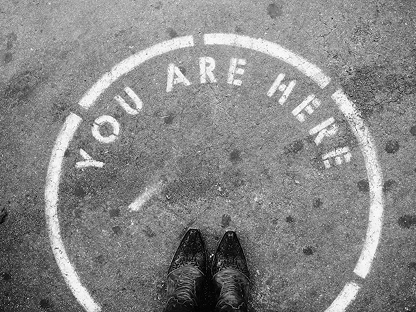 You are here sign painted on a pavement